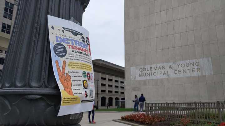 Event poster posted on a lamppost in front of the Coleman A. Young Municipal Center.