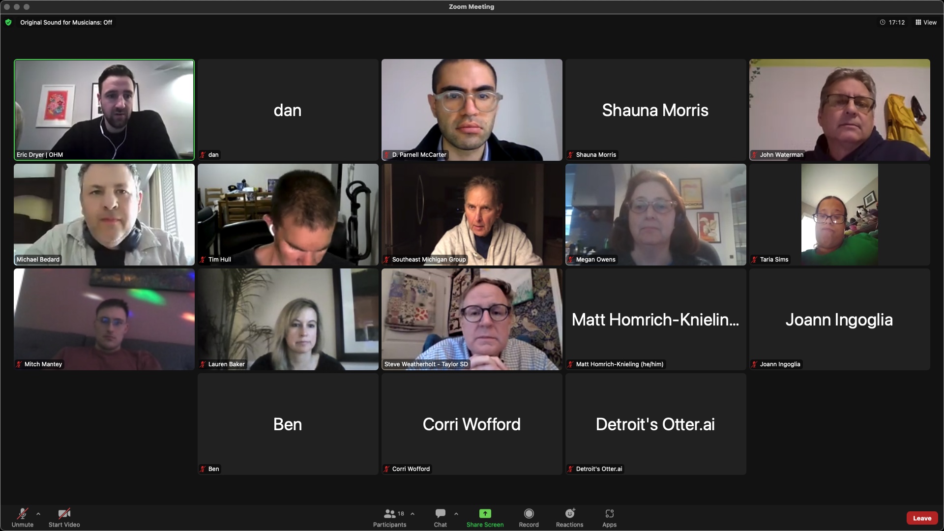 Online meeting application displaying 18 participants, some of whom have video feeds. Eric Dryer (pale skin, black hair, earphones, black shirt) is speaking. Others present are dan, D. Parnell McCarter (pale skin, black hair, glasses, grey shirt), Shauna Morris, John Waterman (pale skin, grey hair, glasses, black sweater), Michael Bedard (pale skin, grey hair, headphones, white shirt), Tim Hull (pale skin, black hair, earphones, black shirt), Southeast Michigan Group (pale skin, grey hair, black shirt, grey hoodie), Megan Owens (pale skin, black hair, glasses, black shirt), Taria Sims (darker skin, black hair, glasses, green shirt), Mitch Mantey (pale skin, black hair, glasses, red shirt), Lauren Baker (pale skin, white hair, black shirt), Steve Weatherholt (pale skin, grey hair, glasses, blue shirt), Matt Homrich-Knieling, Joann Ingoglia, Ben, Corri Wofford and Detroit’s Otter.ai. 